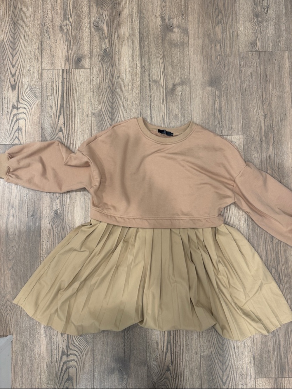 Cropped Beige Sweatshirt with Pleated Tan Skirt Detail